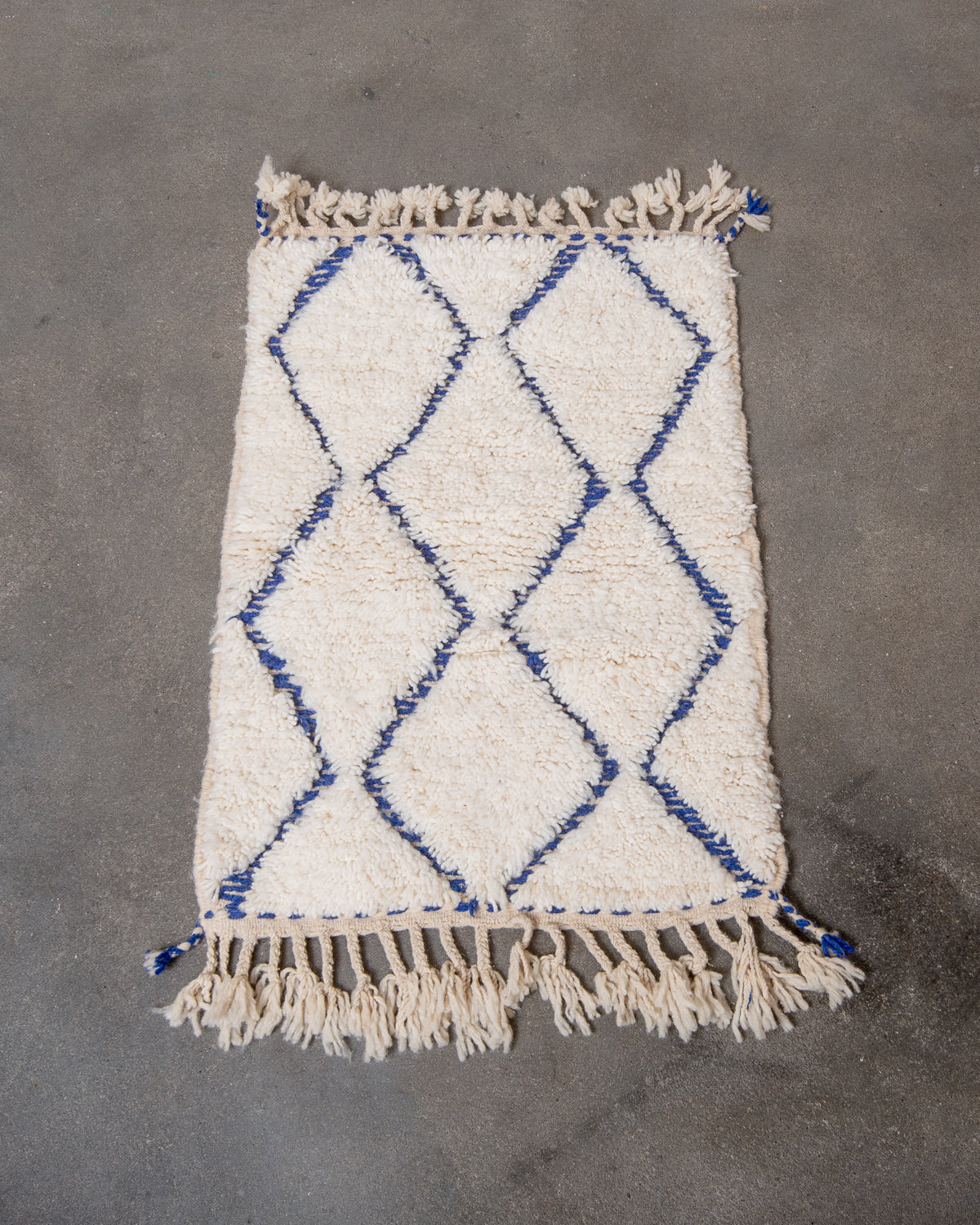 Modern, designer, handcrafted Berber rug from Morocco. Beniourain carpet with beautiful colours and patterns and fluffy wool texture.